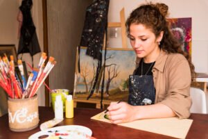 girl painting canvas